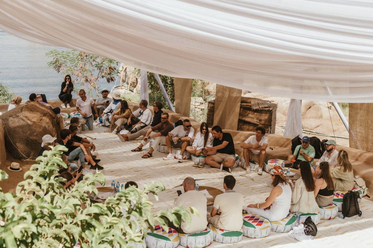 Founders gathered on the riverbank
